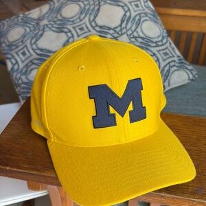 Like new university of Michigan dry fit hat. Yellow university of Michigan hat.